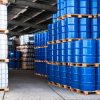 Blue drums and container Blue drums and IBC container in a storage room