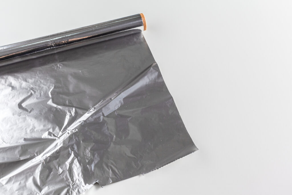 roll of aluminum foil isolated on white background