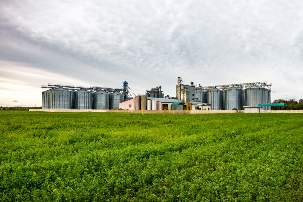 Agricultural processing plant with silos.