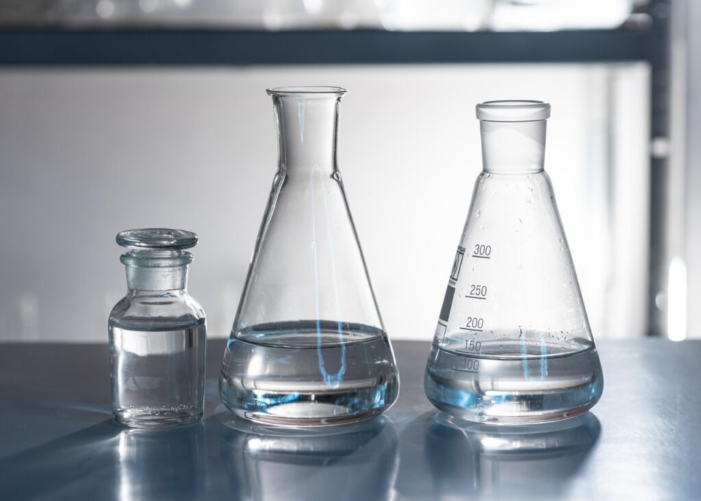 Isotridecyl alcohol in beakers in a chemical lab